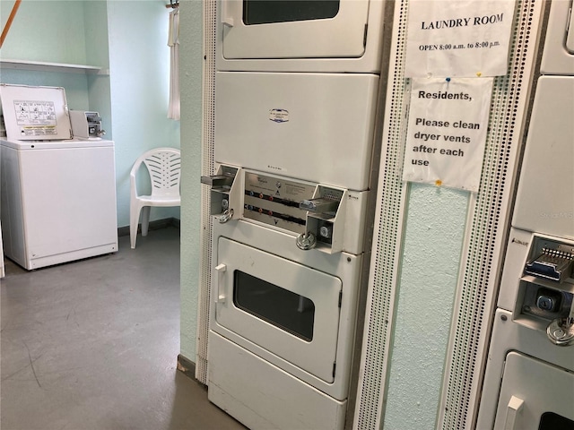 washroom featuring stacked washer / dryer and washing machine and dryer