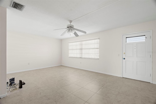 interior space featuring ceiling fan