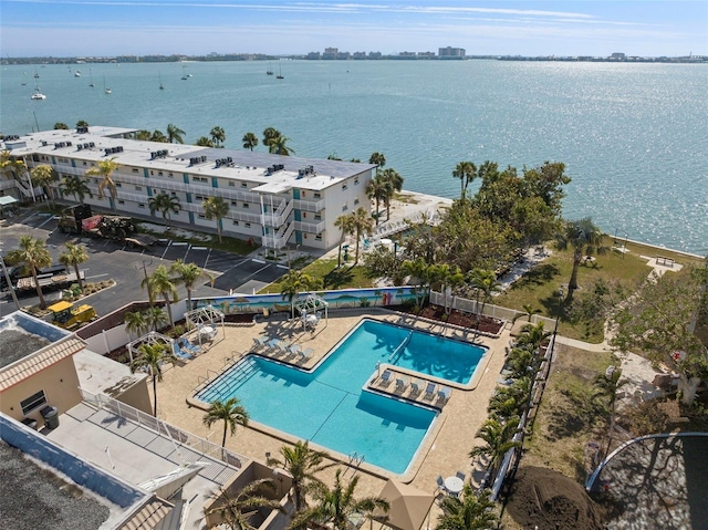 birds eye view of property with a water view