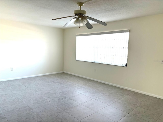 unfurnished room featuring a textured ceiling and ceiling fan