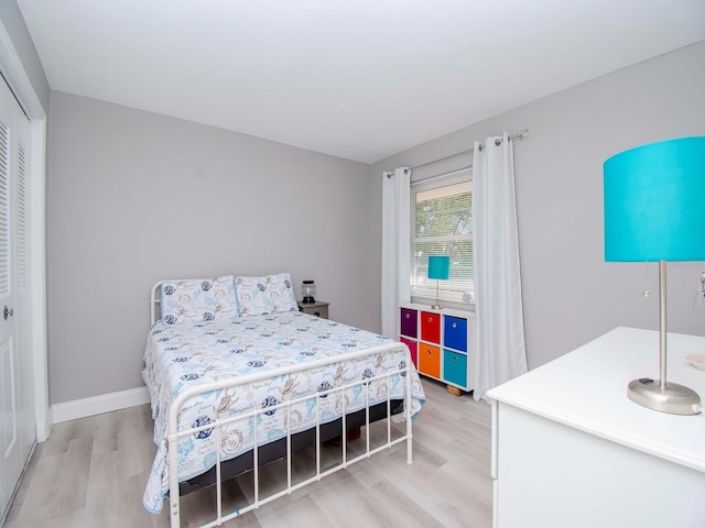 bedroom featuring a closet and light hardwood / wood-style flooring