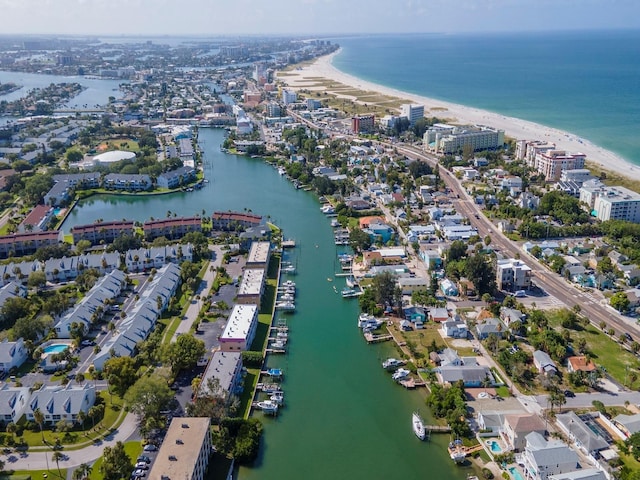 birds eye view of property featuring a view of the beach and a water view