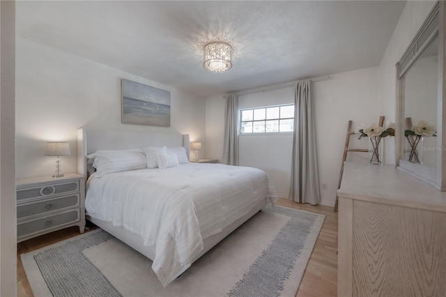 bedroom with light hardwood / wood-style floors