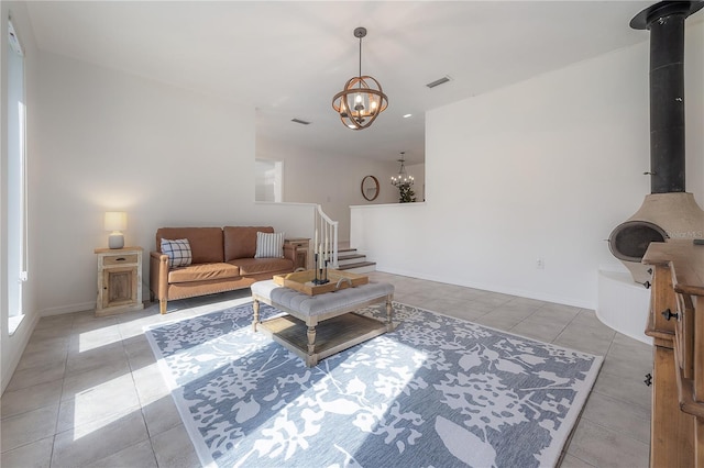 tiled living room with a chandelier