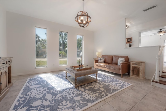 tiled living room with an inviting chandelier