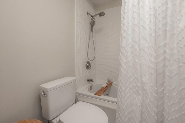 bathroom with toilet and shower / bath combo with shower curtain