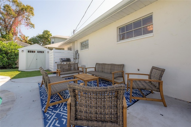 view of patio / terrace featuring an outdoor living space and a storage unit