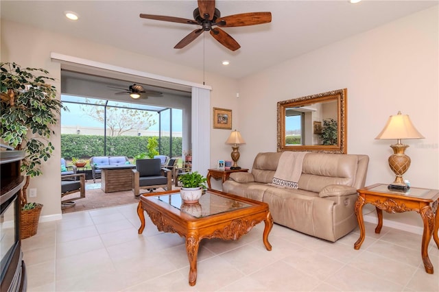 living area featuring recessed lighting, light tile patterned flooring, ceiling fan, and baseboards