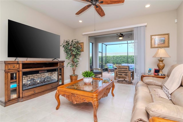 living area with recessed lighting, a sunroom, ceiling fan, and light tile patterned floors