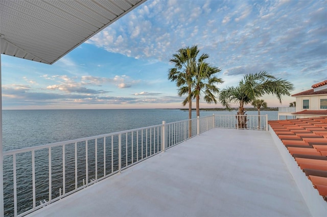 patio terrace at dusk with a water view