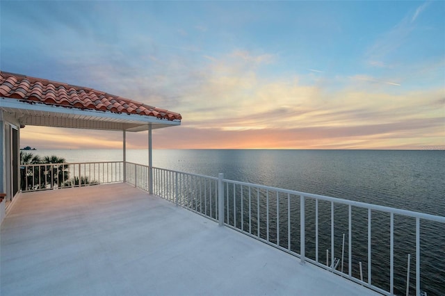 patio terrace at dusk with a water view