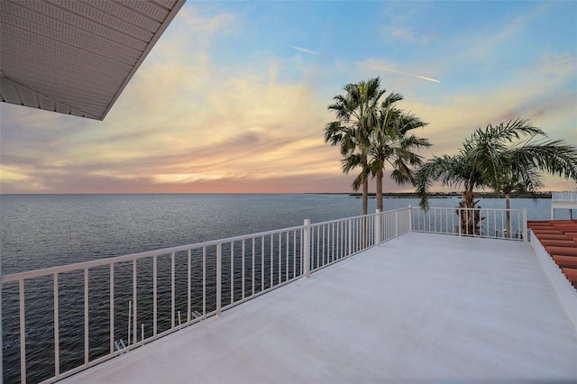 patio terrace at dusk with a water view