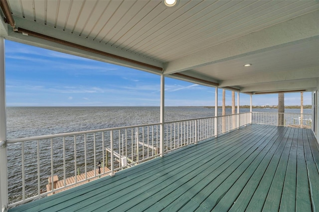 wooden deck featuring a water view