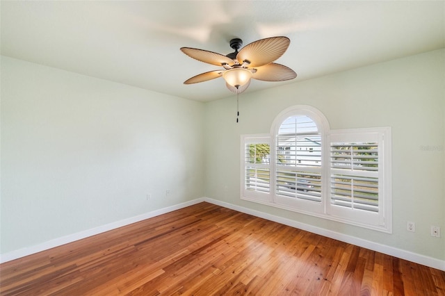 unfurnished room featuring hardwood / wood-style flooring and ceiling fan