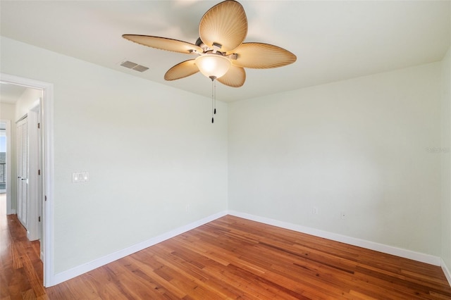 unfurnished room with wood-type flooring and ceiling fan