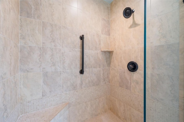 bathroom with tiled shower