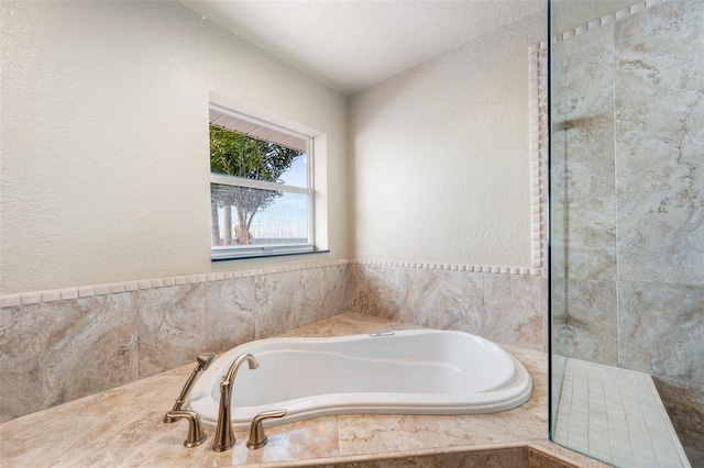 bathroom with tiled bath