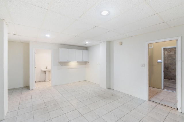 spare room with a paneled ceiling