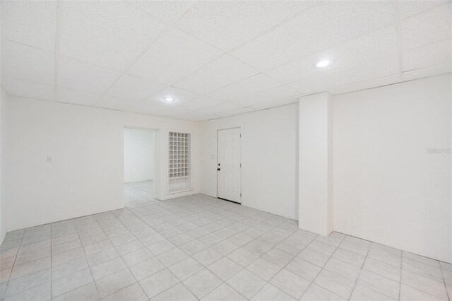 spare room featuring a paneled ceiling