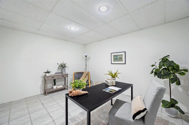 6423 Driftwood Dr, Hudson, FL 34667 - home office with light tile patterned flooring, a paneled ceiling, and recessed lighting