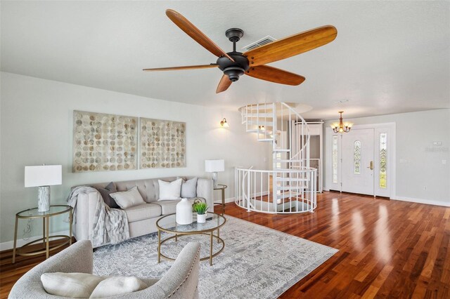6423 Driftwood Dr, Hudson, FL 34667 - living room with baseboards, wood finished floors, ceiling fan, and a chandelier