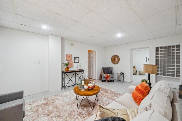 6423 Driftwood Dr, Hudson, FL 34667 - living area with tile patterned flooring, a paneled ceiling, and recessed lighting