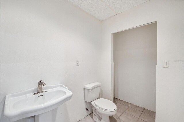 6423 Driftwood Dr, Hudson, FL 34667 - half bath featuring toilet, a sink, and tile patterned flooring