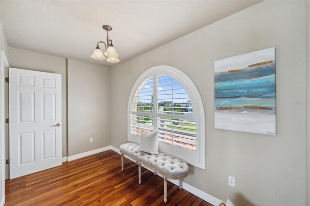 6423 Driftwood Dr, Hudson, FL 34667 - sitting room featuring a chandelier, baseboards, and wood finished floors