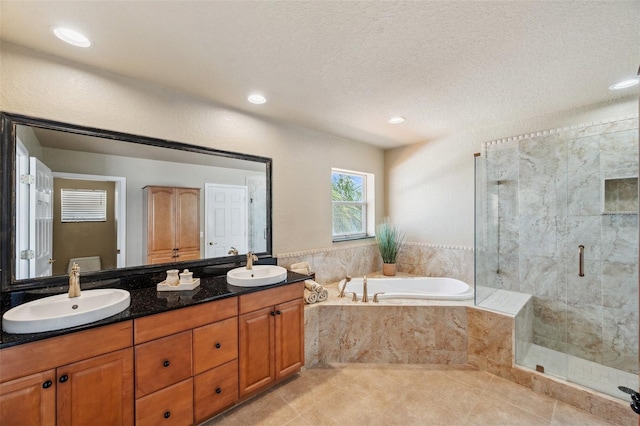 6423 Driftwood Dr, Hudson, FL 34667 - bathroom featuring a garden tub, a stall shower, double vanity, tile patterned flooring, and recessed lighting