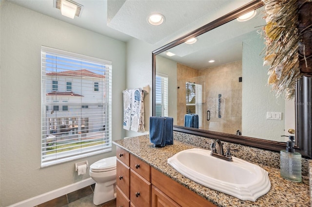 6423 Driftwood Dr, Hudson, FL 34667 - full bath with vanity, toilet, a stall shower, baseboards, and a textured ceiling