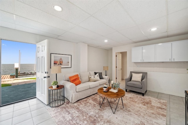 6423 Driftwood Dr, Hudson, FL 34667 - living room featuring light tile patterned floors, a paneled ceiling, a water view, and recessed lighting