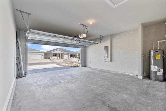 garage featuring electric panel, water heater, and a garage door opener