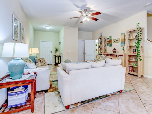 living room featuring ceiling fan and light tile patterned floors