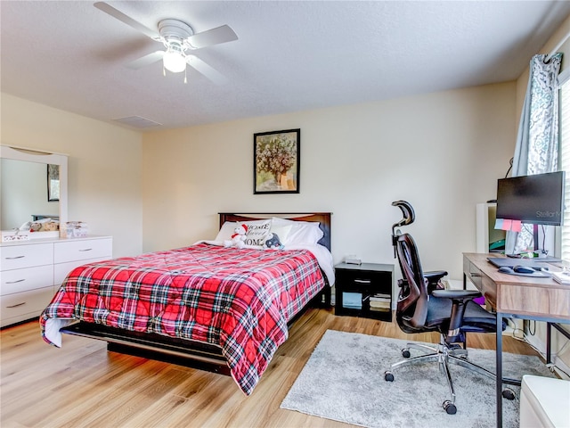 bedroom featuring ceiling fan and light hardwood / wood-style flooring