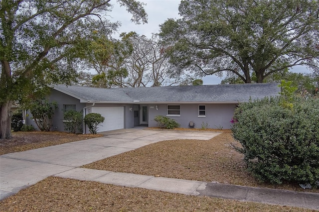 single story home featuring a garage