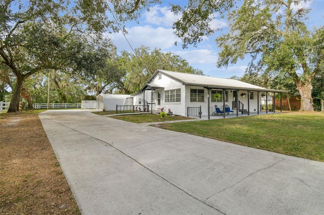 view of front of home with a front lawn and covered porch