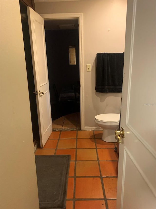 bathroom featuring tile patterned flooring and toilet