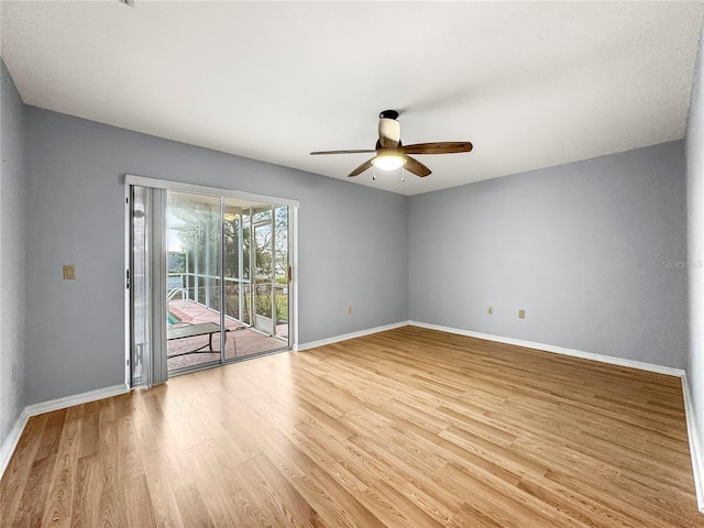 spare room with light hardwood / wood-style floors and ceiling fan