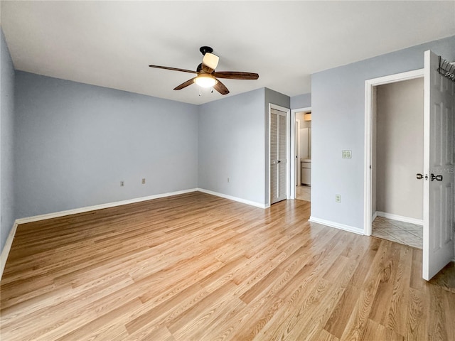 unfurnished bedroom featuring light wood-type flooring and ceiling fan