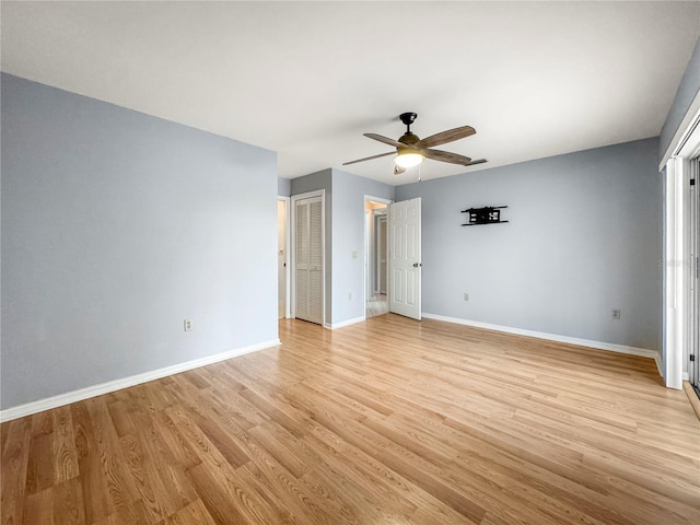 unfurnished bedroom with ceiling fan and light hardwood / wood-style flooring