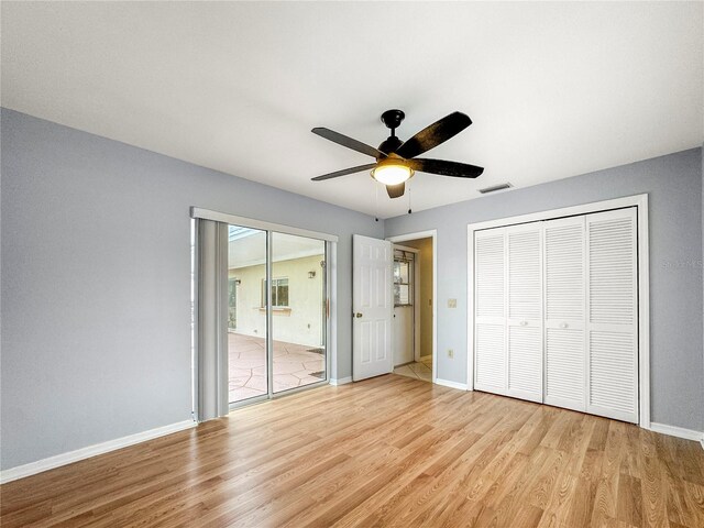 unfurnished bedroom with ceiling fan and light hardwood / wood-style flooring