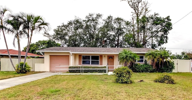 ranch-style home with a front yard and a garage