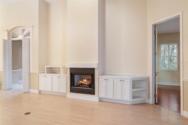 unfurnished living room featuring light hardwood / wood-style flooring