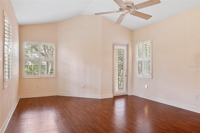 spare room featuring ceiling fan, dark wood-type flooring, and lofted ceiling