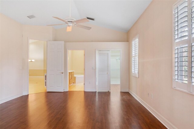 unfurnished bedroom featuring vaulted ceiling, ceiling fan, a closet, and multiple windows