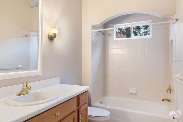 full bathroom featuring shower / bath combination, toilet, and vanity