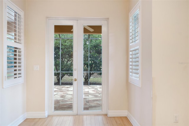 doorway featuring french doors and light hardwood / wood-style floors