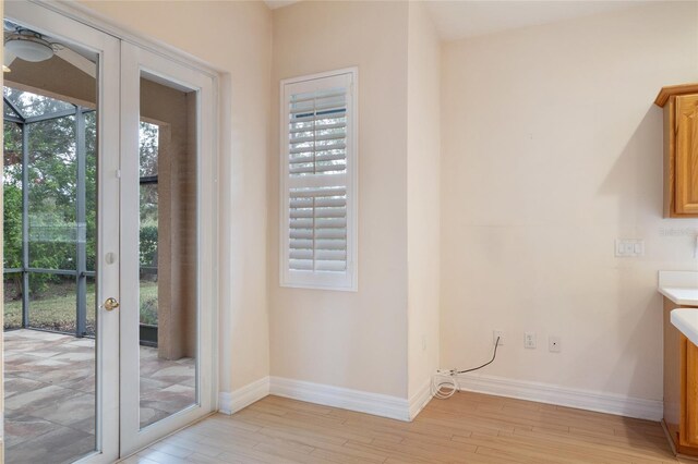 doorway to outside with light hardwood / wood-style floors and french doors