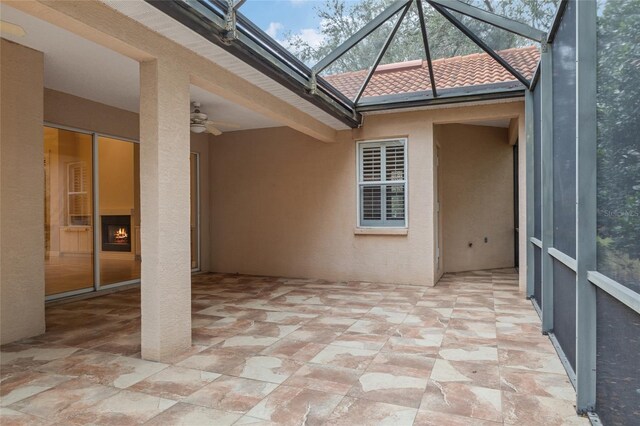 exterior space featuring ceiling fan