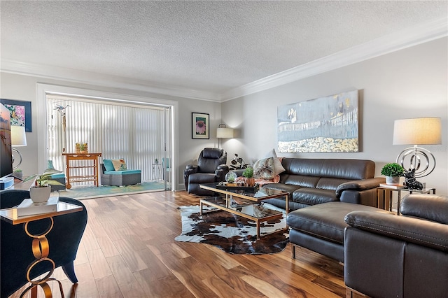 living room with a textured ceiling, ornamental molding, and hardwood / wood-style floors